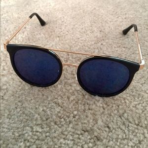 Blue tint cat eye sunglasses with gold frame